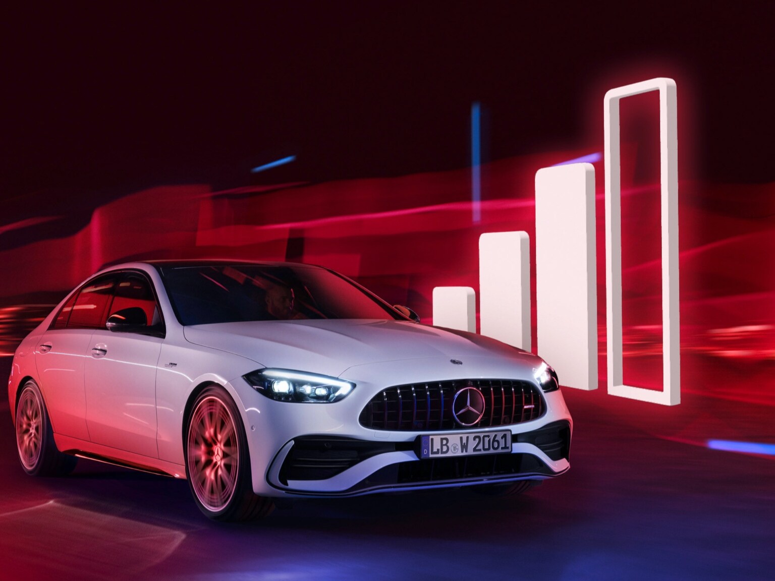 Mercedes-Benz przejeżdża obok wizualizacji symbolu zasięgu.